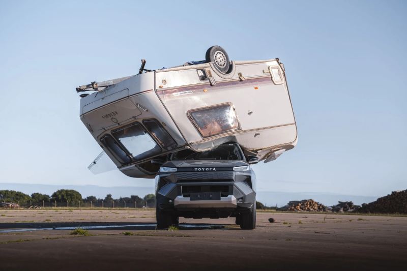 Toyota Drops a Caravan on the Hilux BEV to Recreate Top Gear’s Famous Test